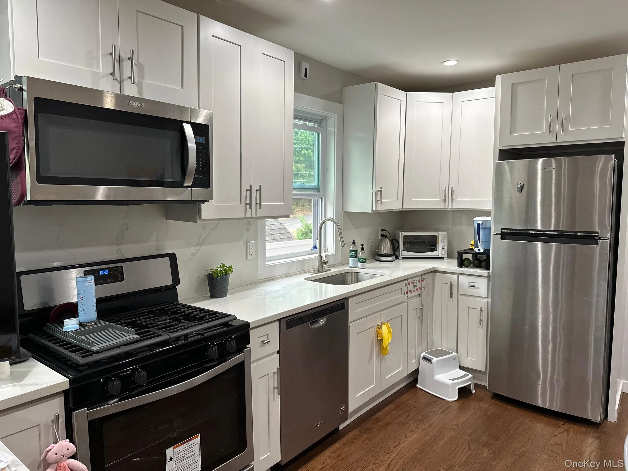 Kitchen with stainless steel appliances, white cabinets, and recessed lighting Kitchen with stainless steel appliances, white cabinets, and recessed lighting
