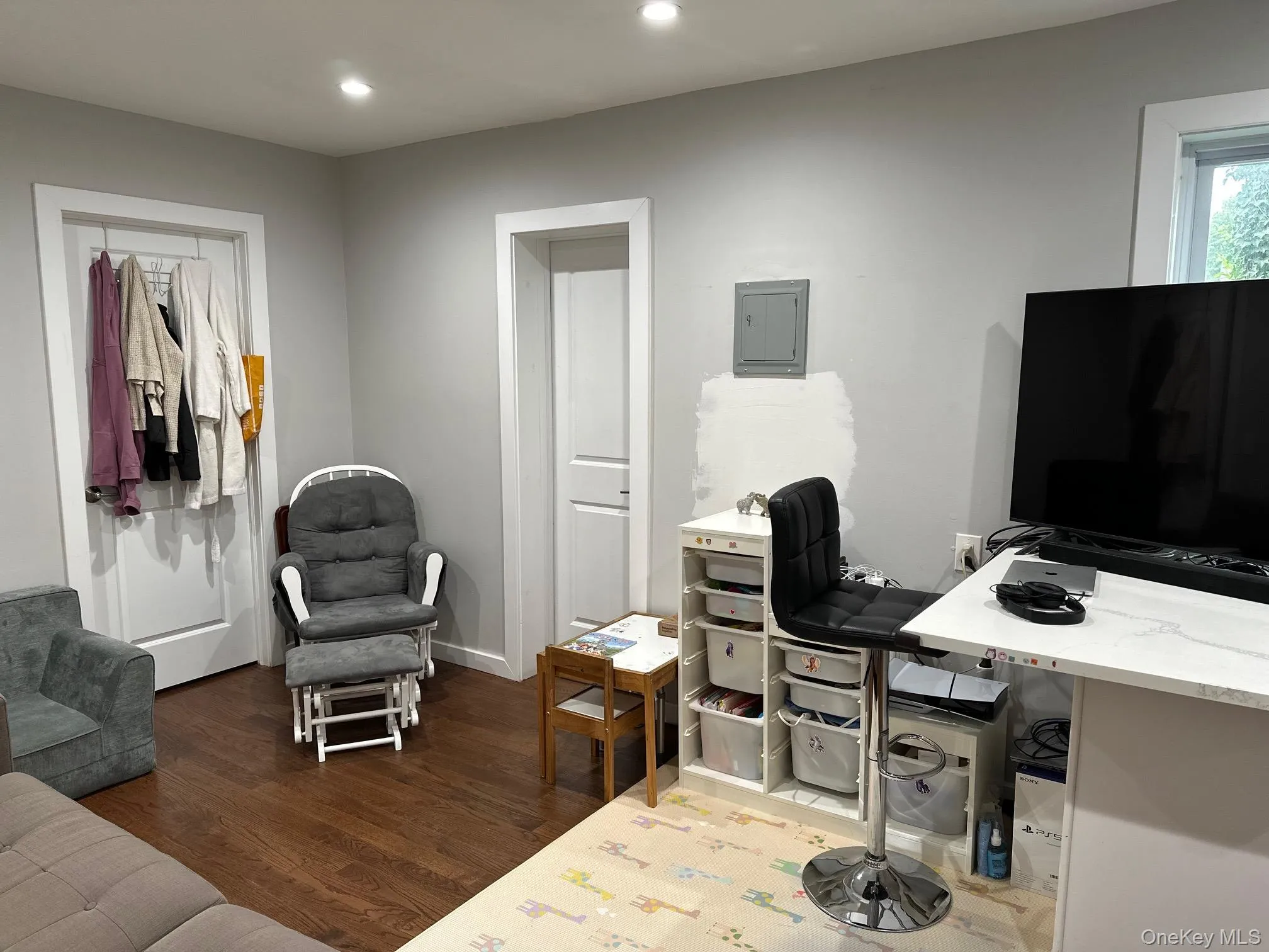 Office space with wood finished floors, recessed lighting, and electric panel Office space with wood finished floors, recessed lighting, and electric panel