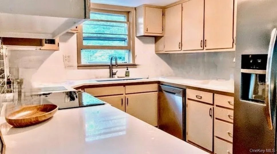 Kitchen featuring light countertops and stainless steel appliances Kitchen featuring light countertops and stainless steel appliances