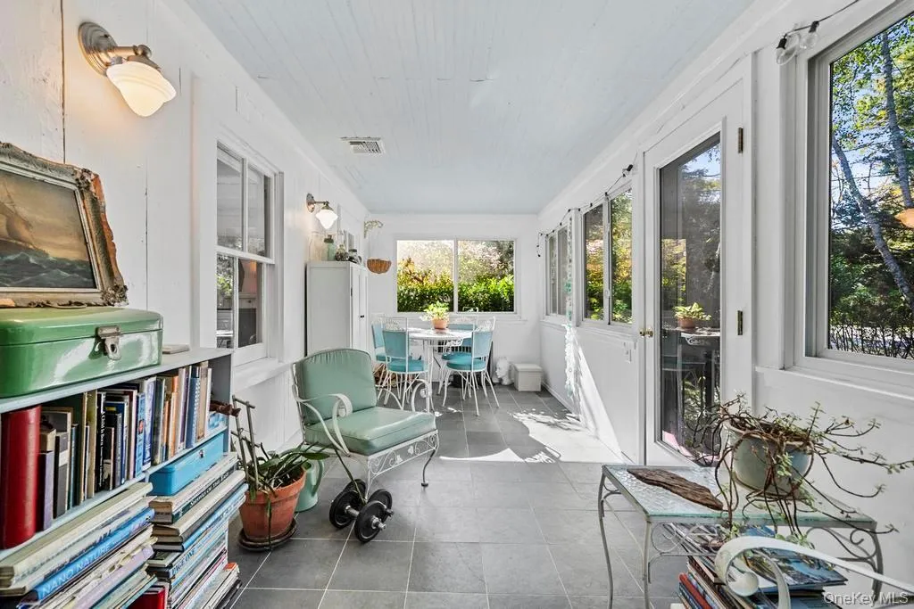 Sunroom / solarium with tile patterned floors Sunroom / solarium with tile patterned floors