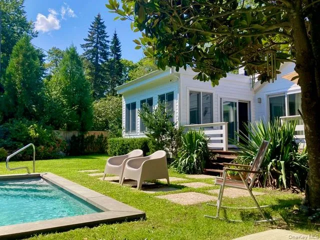 Rear view of property featuring an outdoor pool and a patio Rear view of property featuring an outdoor pool and a patio