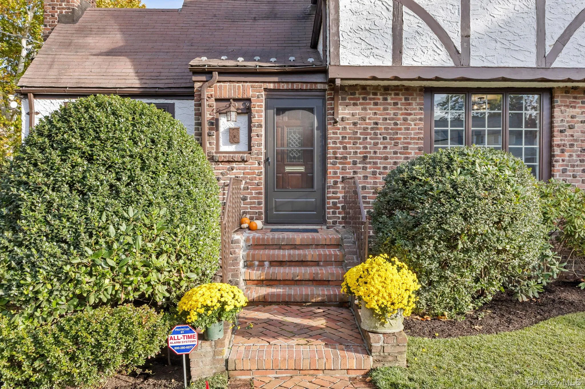 View of exterior entry with a chimney and brick siding View of exterior entry with a chimney and brick siding