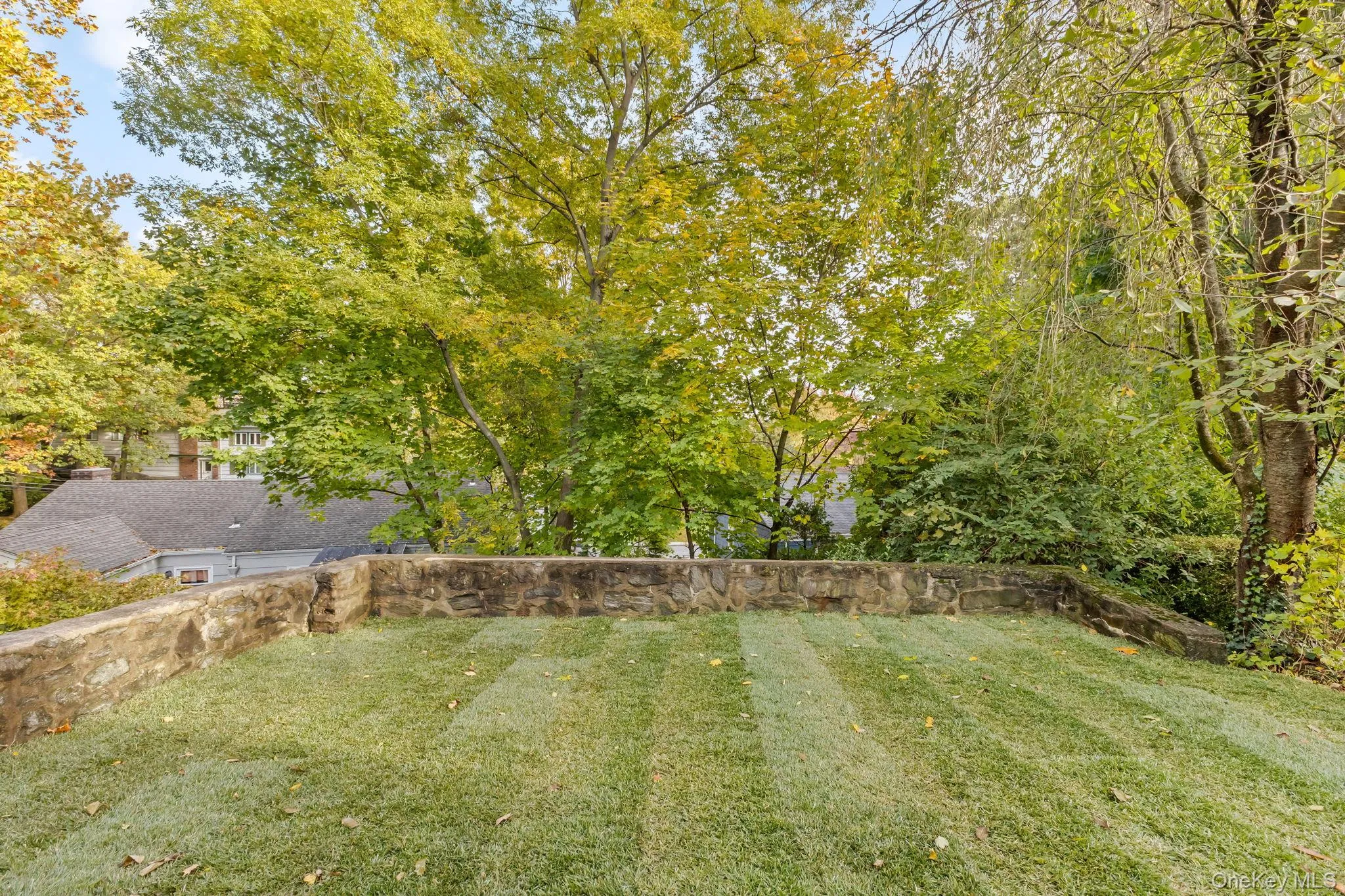 View of grassy yard with view of scattered trees View of grassy yard with view of scattered trees