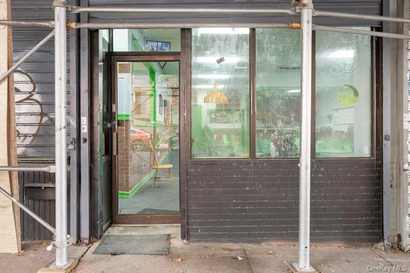Entrance to property featuring brick siding Entrance to property featuring brick siding