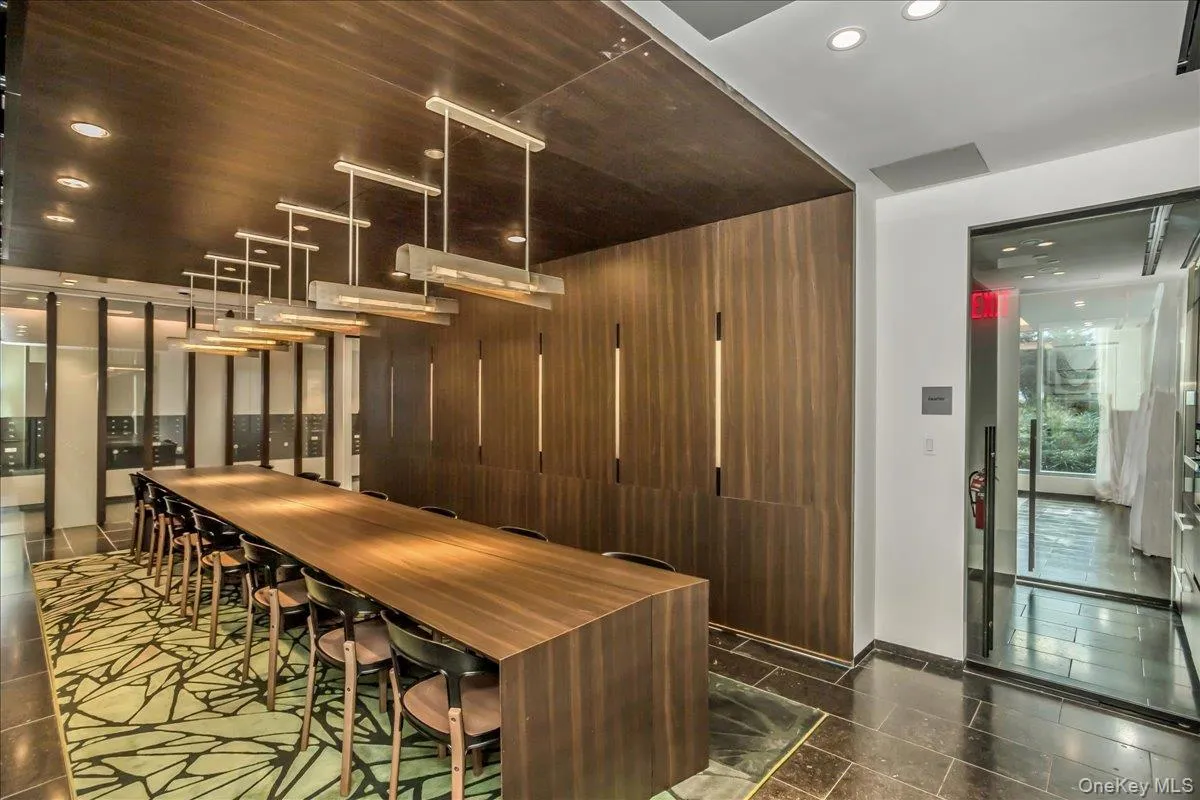 Bar area with recessed lighting, pendant lighting, and modern cabinets Bar area with recessed lighting, pendant lighting, and modern cabinets