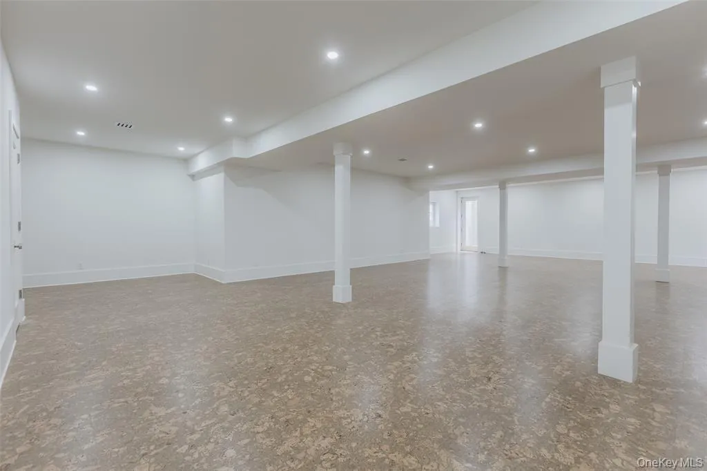 Finished basement with stairs and recessed lighting Finished basement with stairs and recessed lighting