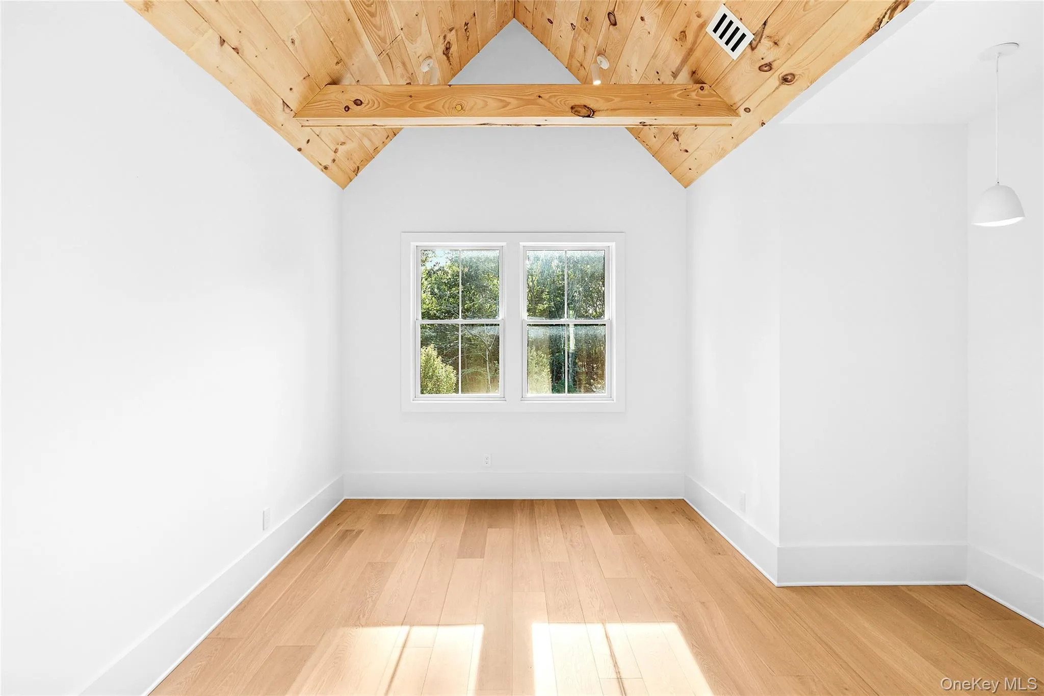 Bedroom with light wood-style floors and wooden ceiling Bedroom with light wood-style floors and wooden ceiling