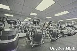 Exercise room featuring a drop ceiling Exercise room featuring a drop ceiling