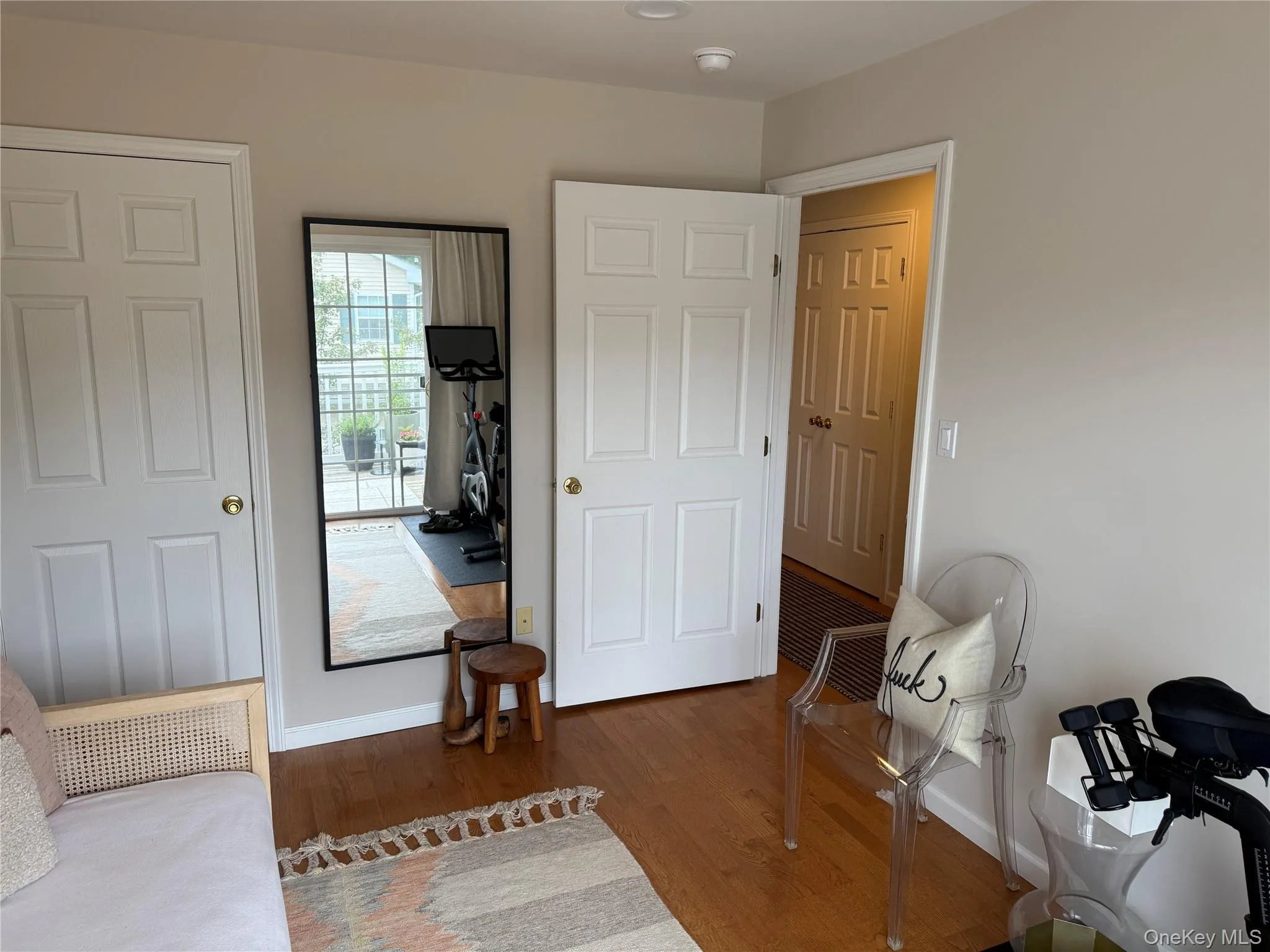 Living area featuring wood finished floors and baseboards Living area featuring wood finished floors and baseboards