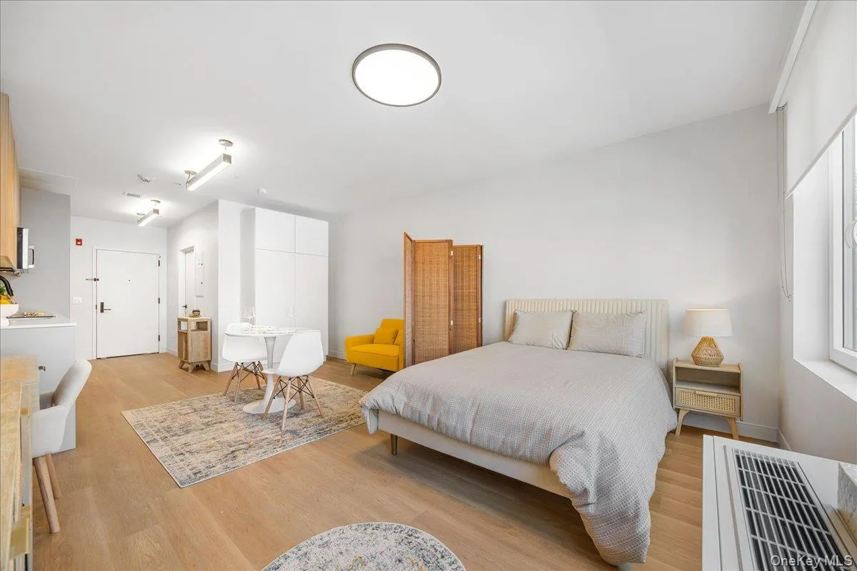 Bedroom featuring light wood-type flooring Bedroom featuring light wood-type flooring