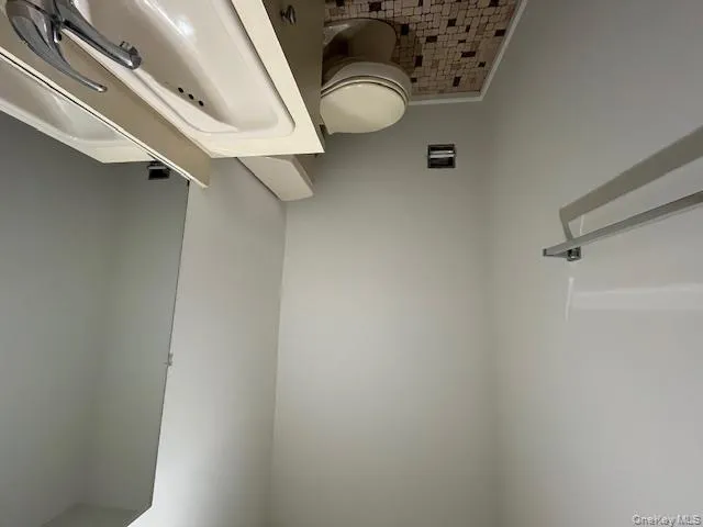 Bathroom featuring vanity and tile patterned floors Bathroom featuring vanity and tile patterned floors