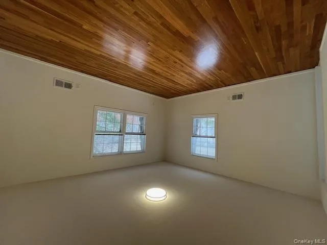 Bedroom featuring dark wood-style floors and baseboards Bedroom featuring dark wood-style floors and baseboards