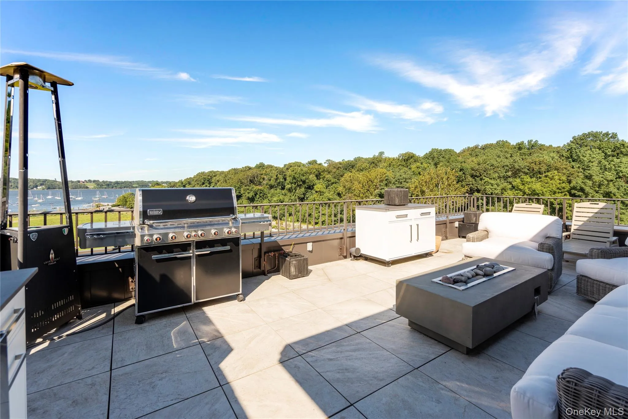 View of rooftop terrace with an outdoor kitchen and a water view View of rooftop terrace with an outdoor kitchen and a water view