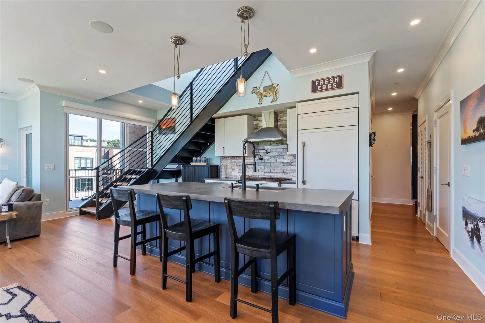Kitchen with crown molding, pendant light fixtures, and recessed lighting Kitchen with crown molding, pendant light fixtures, and recessed lighting
