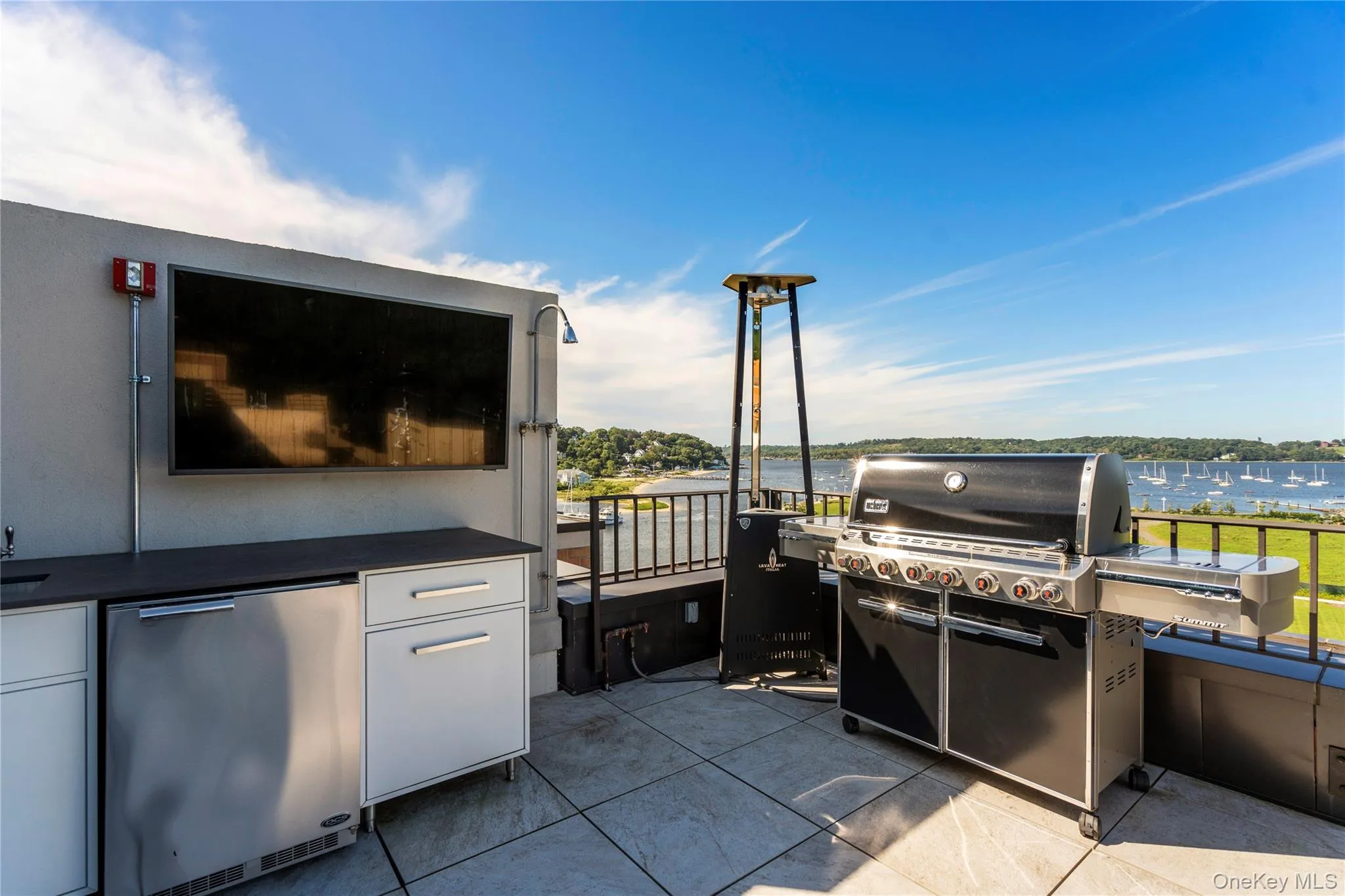 View of rooftop terrace with an outdoor kitchen and a water view View of rooftop terrace with an outdoor kitchen and a water view