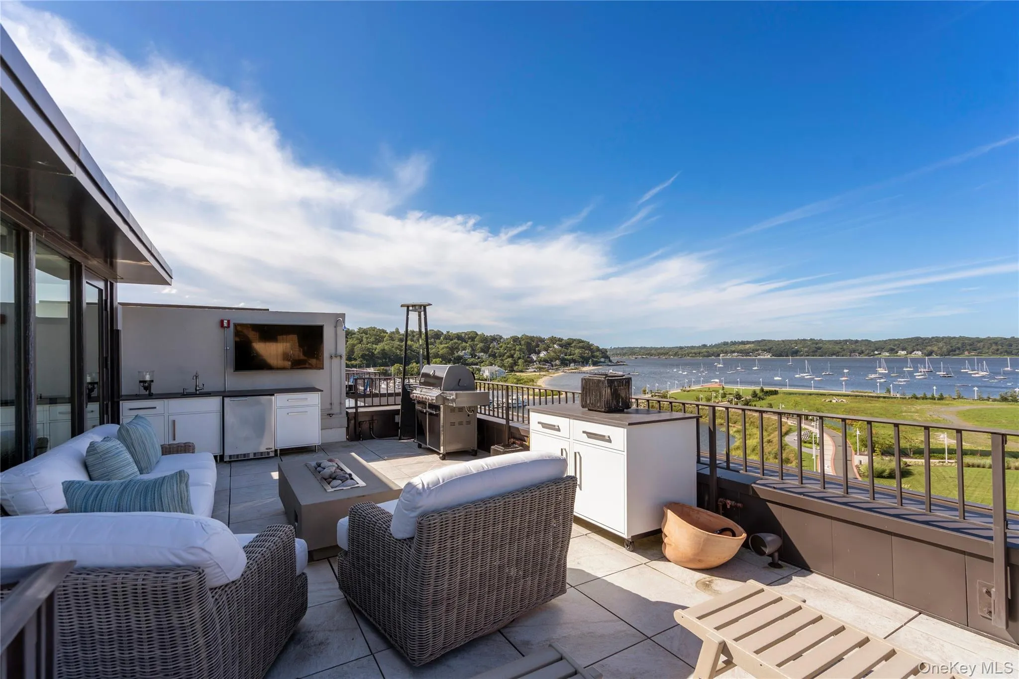 View of rooftop terrace with an outdoor kitchen and a water view View of rooftop terrace with an outdoor kitchen and a water view