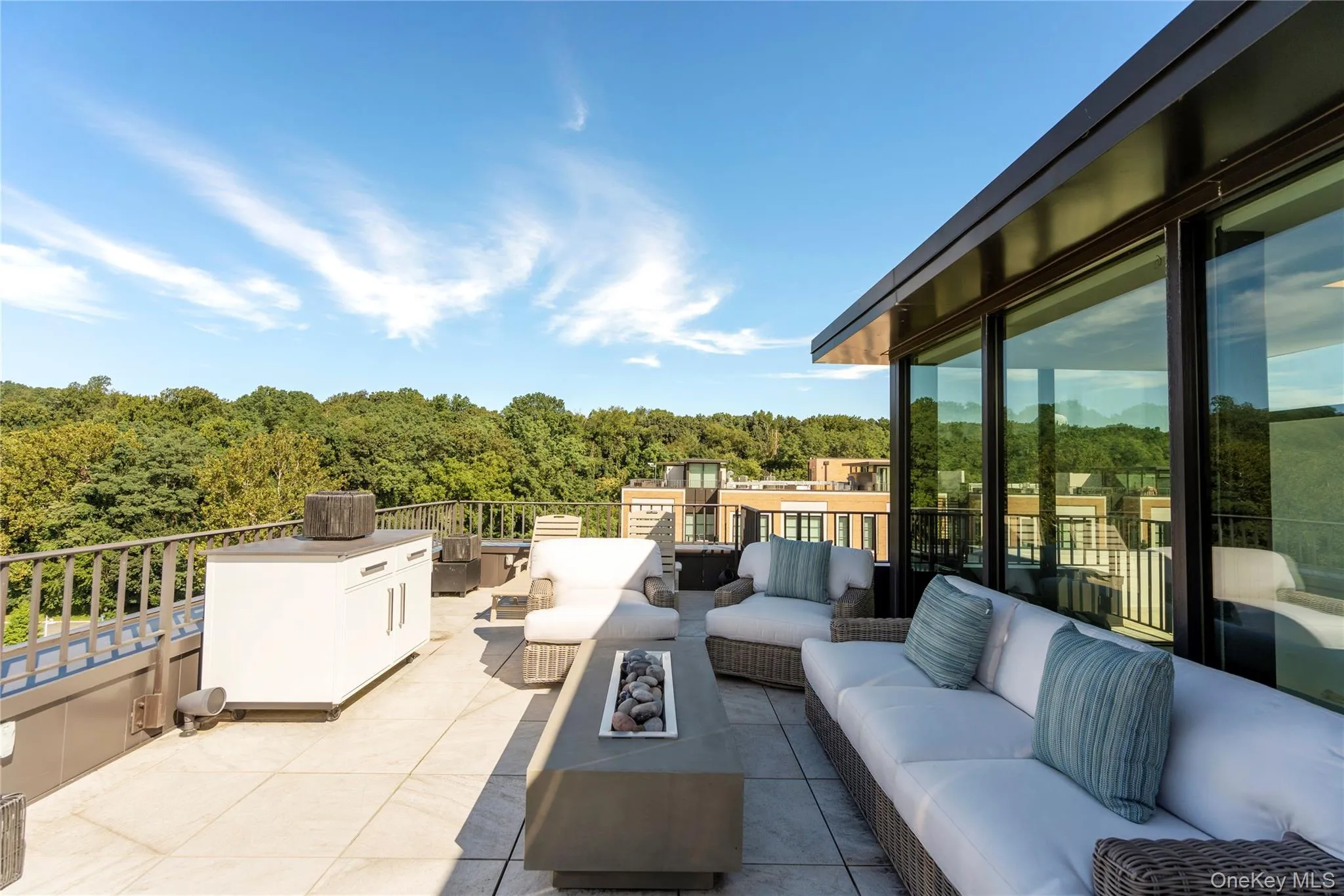 View of rooftop terrace with an outdoor kitchen and a water view View of rooftop terrace with an outdoor kitchen and a water view