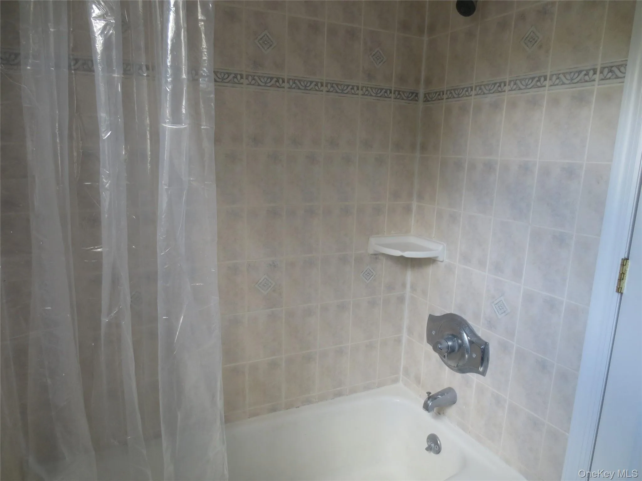 Full bathroom with shower / bath combination with curtain Full bathroom with shower / bath combination with curtain