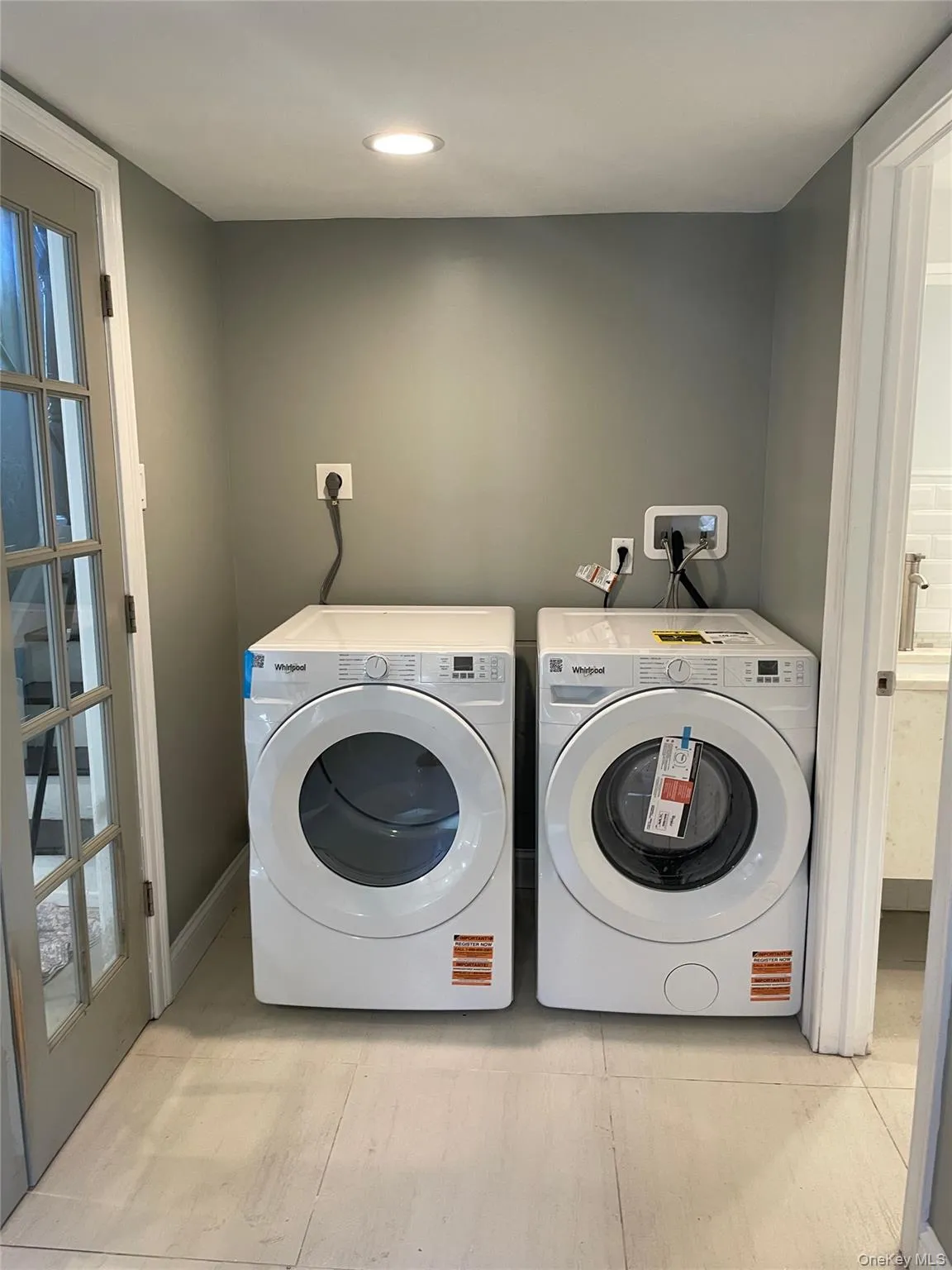 Laundry area with recessed lighting and washer and clothes dryer Laundry area with recessed lighting and washer and clothes dryer
