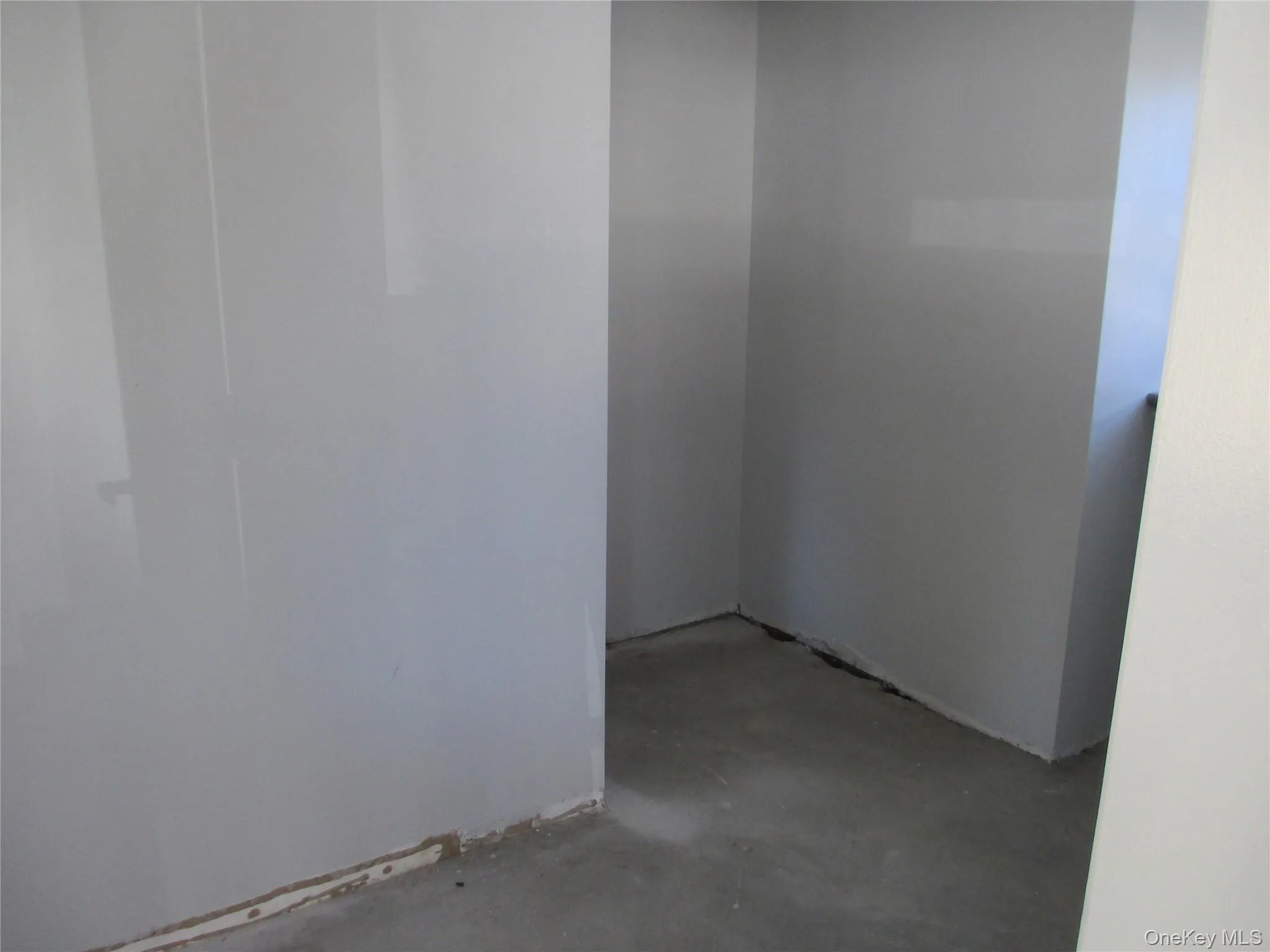 Spare room with concrete flooring Spare room with concrete flooring