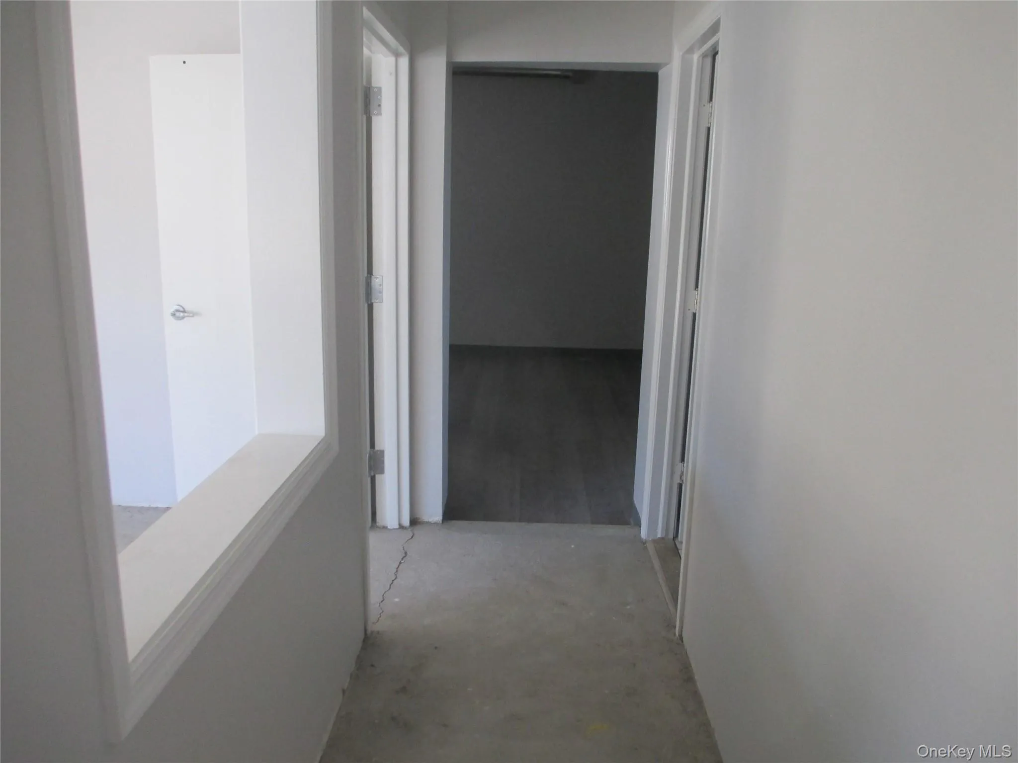 Hall featuring concrete floors Hall featuring concrete floors