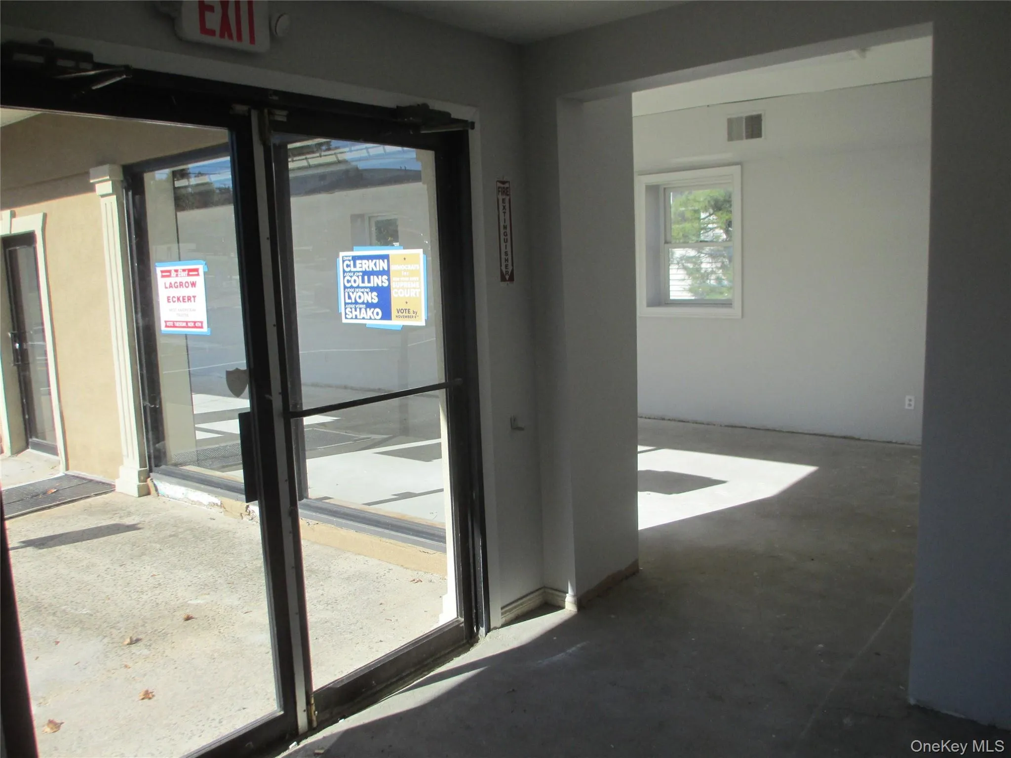 Entryway with unfinished concrete flooring Entryway with unfinished concrete flooring