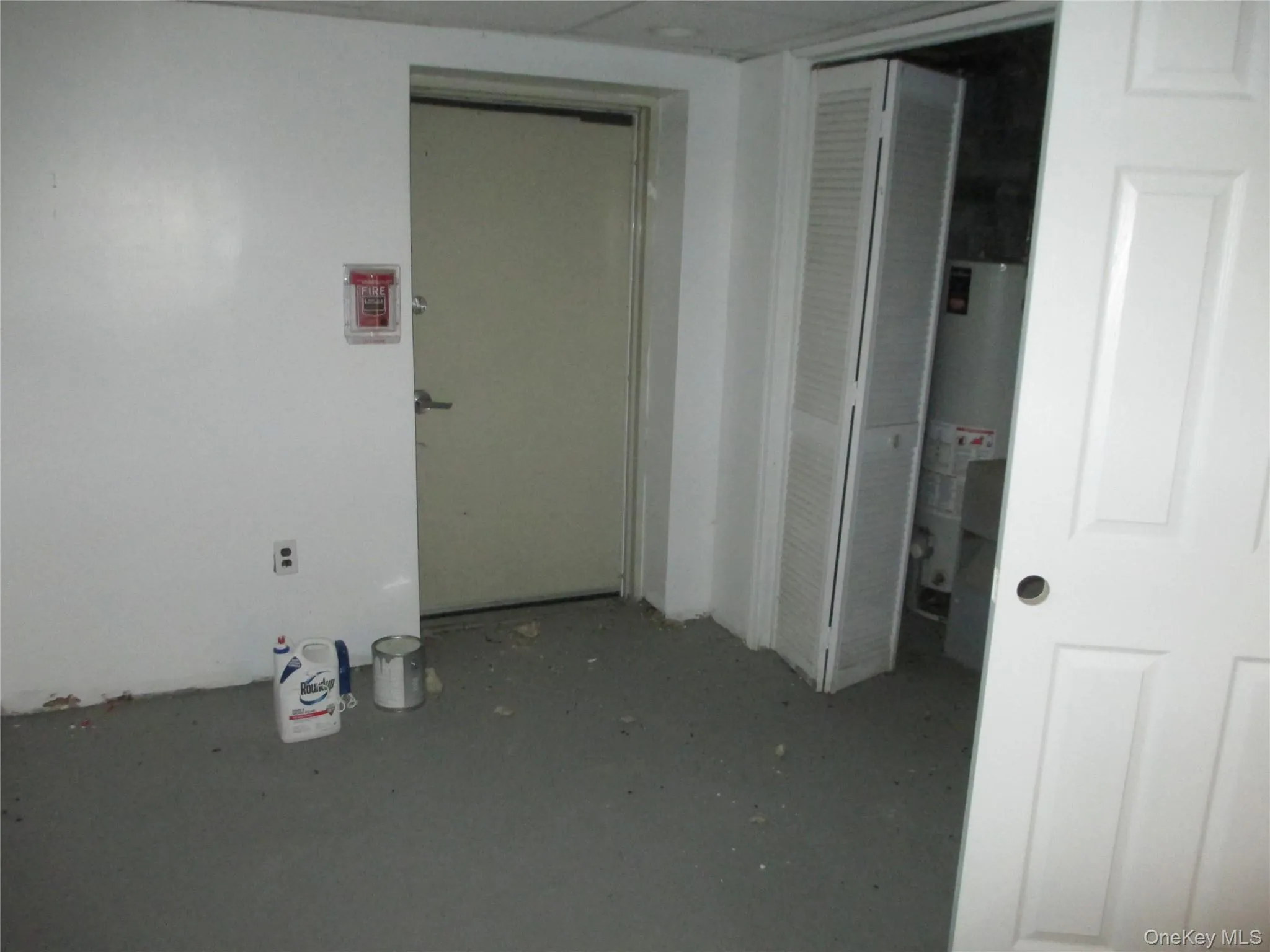 Hall featuring water heater Hall featuring water heater