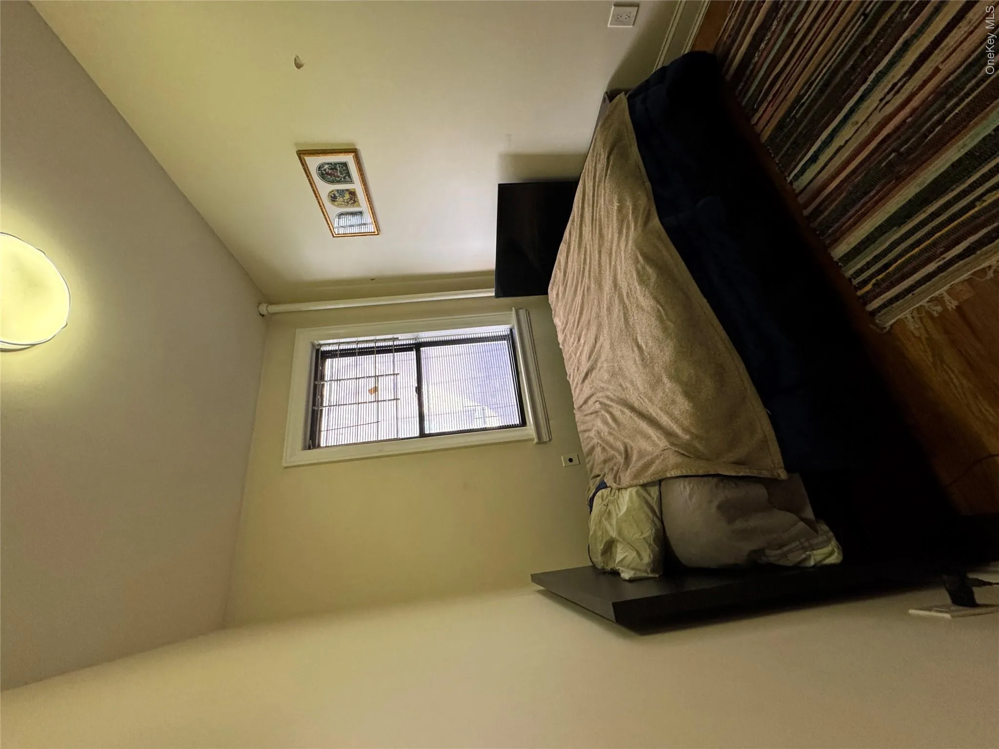 Bedroom featuring wood finished floors and baseboards Bedroom featuring wood finished floors and baseboards