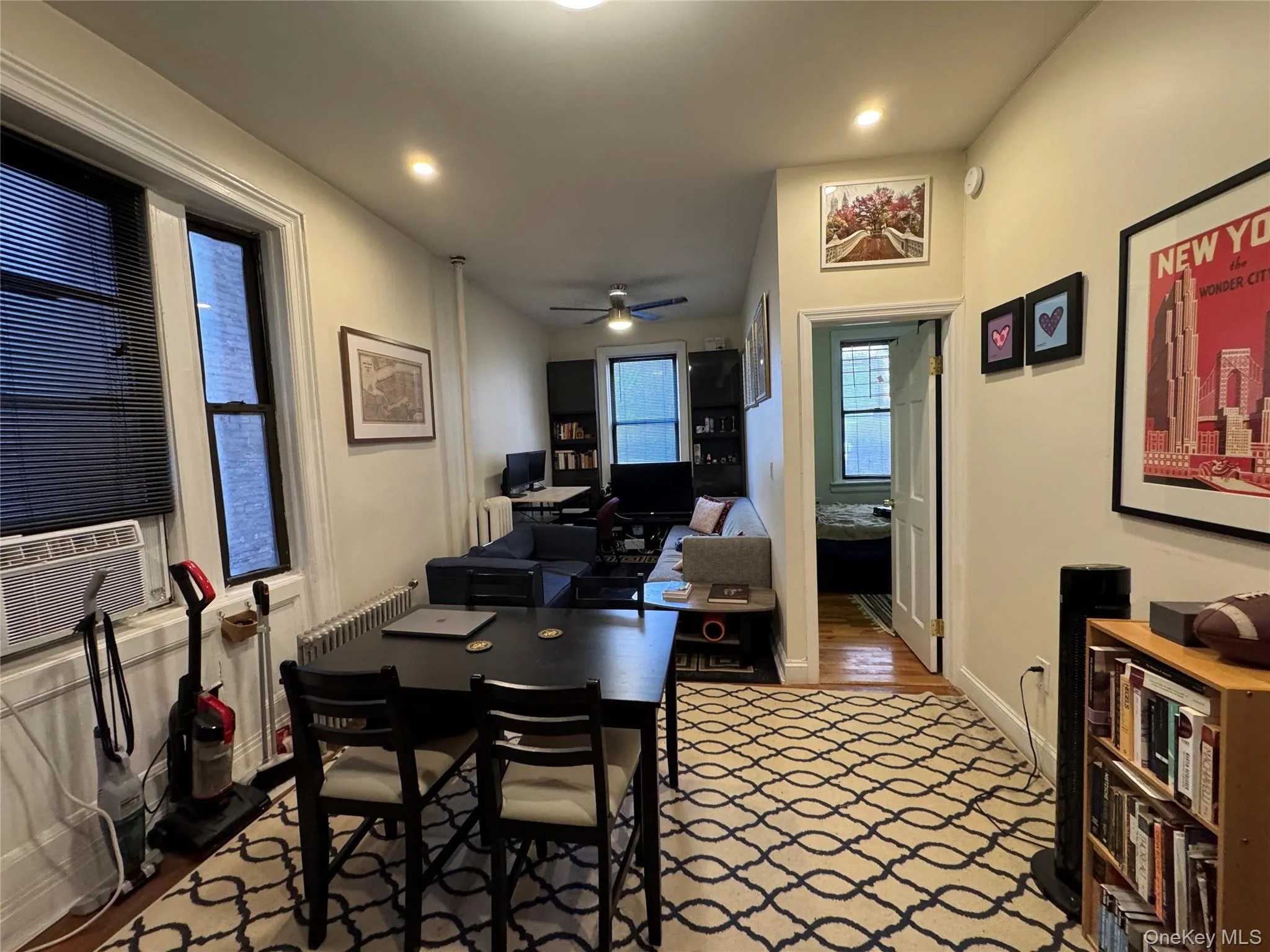 Dining room featuring a desk, wood finished floors, ceiling fan, cooling unit, and recessed lighting Dining room featuring a desk, wood finished floors, ceiling fan, cooling unit, and recessed lighting
