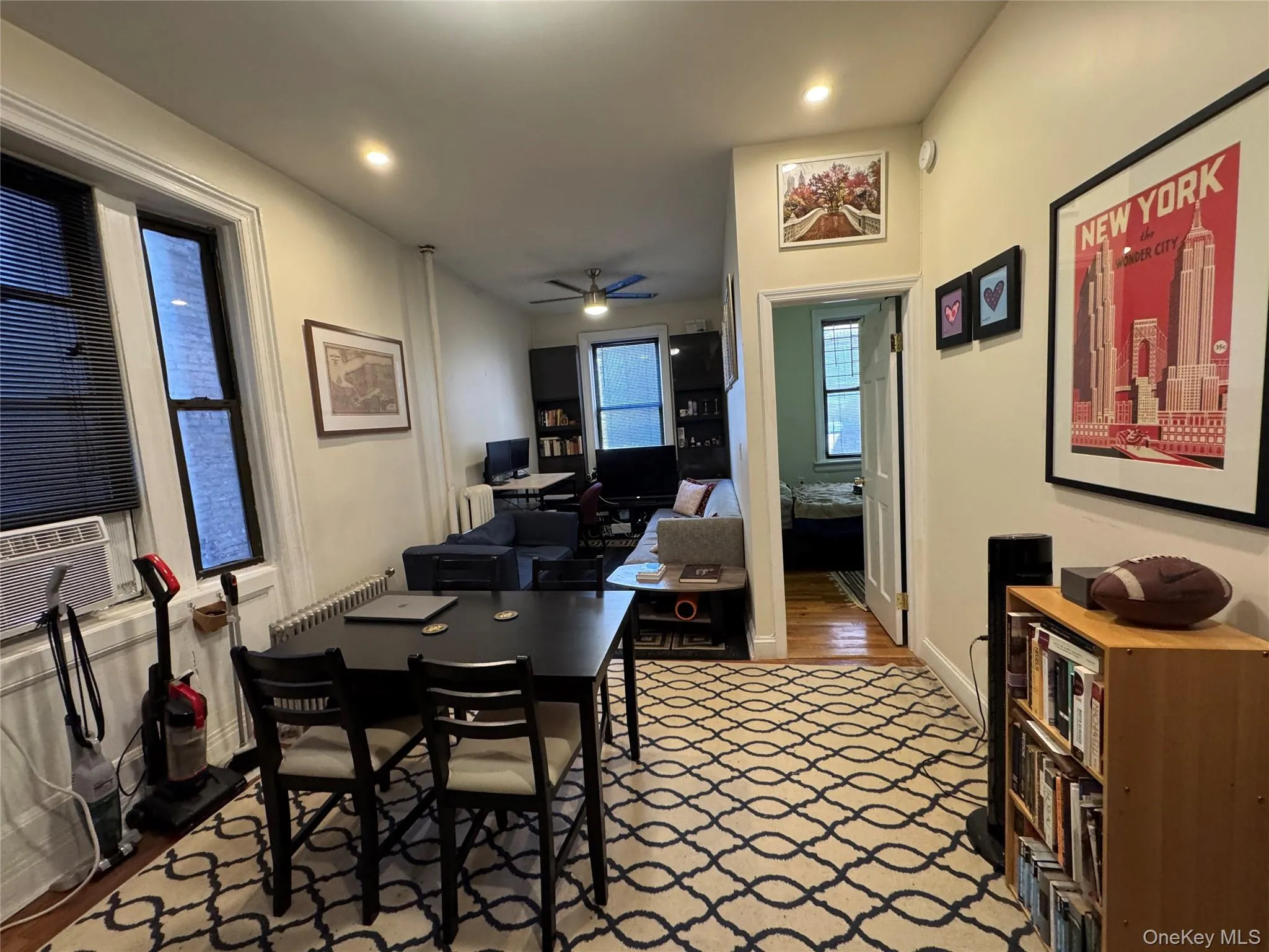 Dining room featuring ceiling fan, a desk, light wood-style floors, cooling unit, and recessed lighting Dining room featuring ceiling fan, a desk, light wood-style floors, cooling unit, and recessed lighting