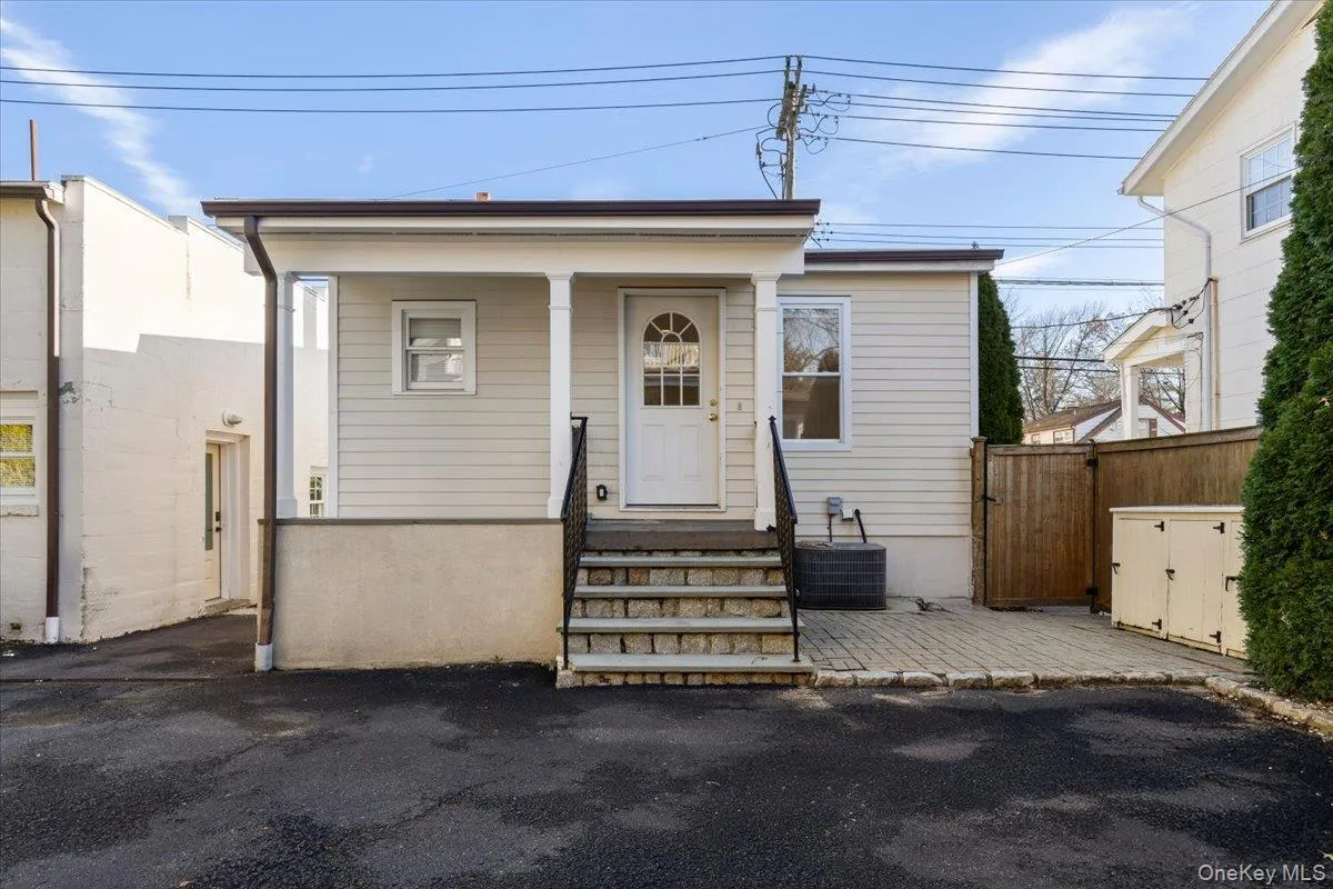 Back entrance to home reads as a welcoming front stoop and portico! Back entrance to home reads as a welcoming front stoop and portico!