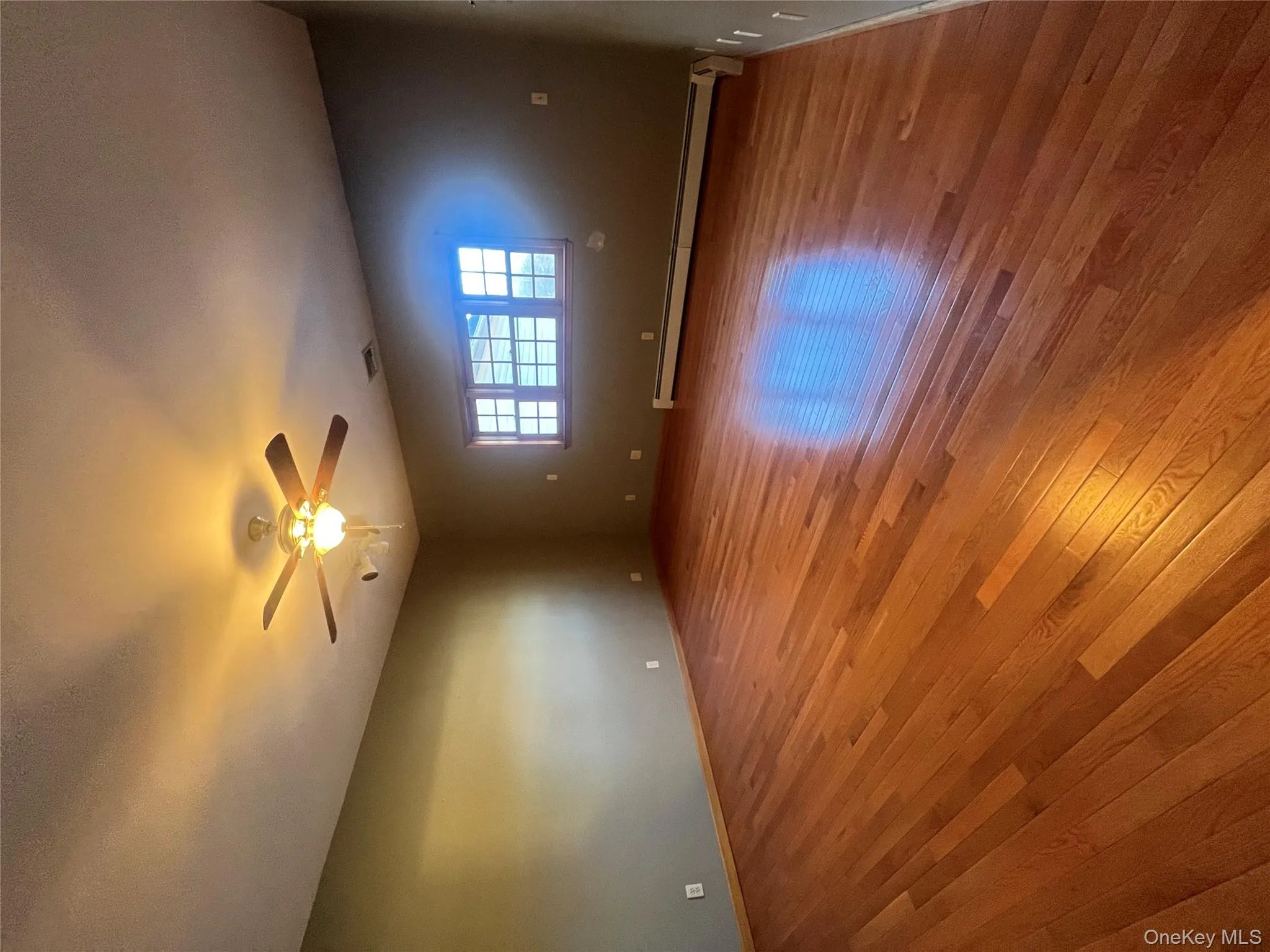 Spare room featuring a baseboard heating unit, light wood-style flooring, a textured ceiling, and ceiling fan Spare room featuring a baseboard heating unit, light wood-style flooring, a textured ceiling, and ceiling fan