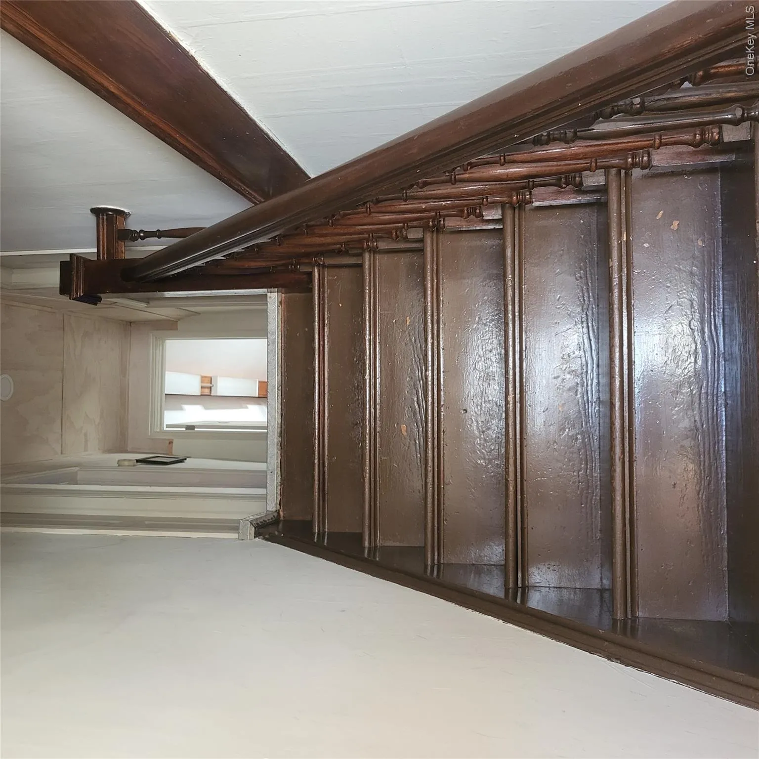 Stairway featuring baseboards Stairway featuring baseboards