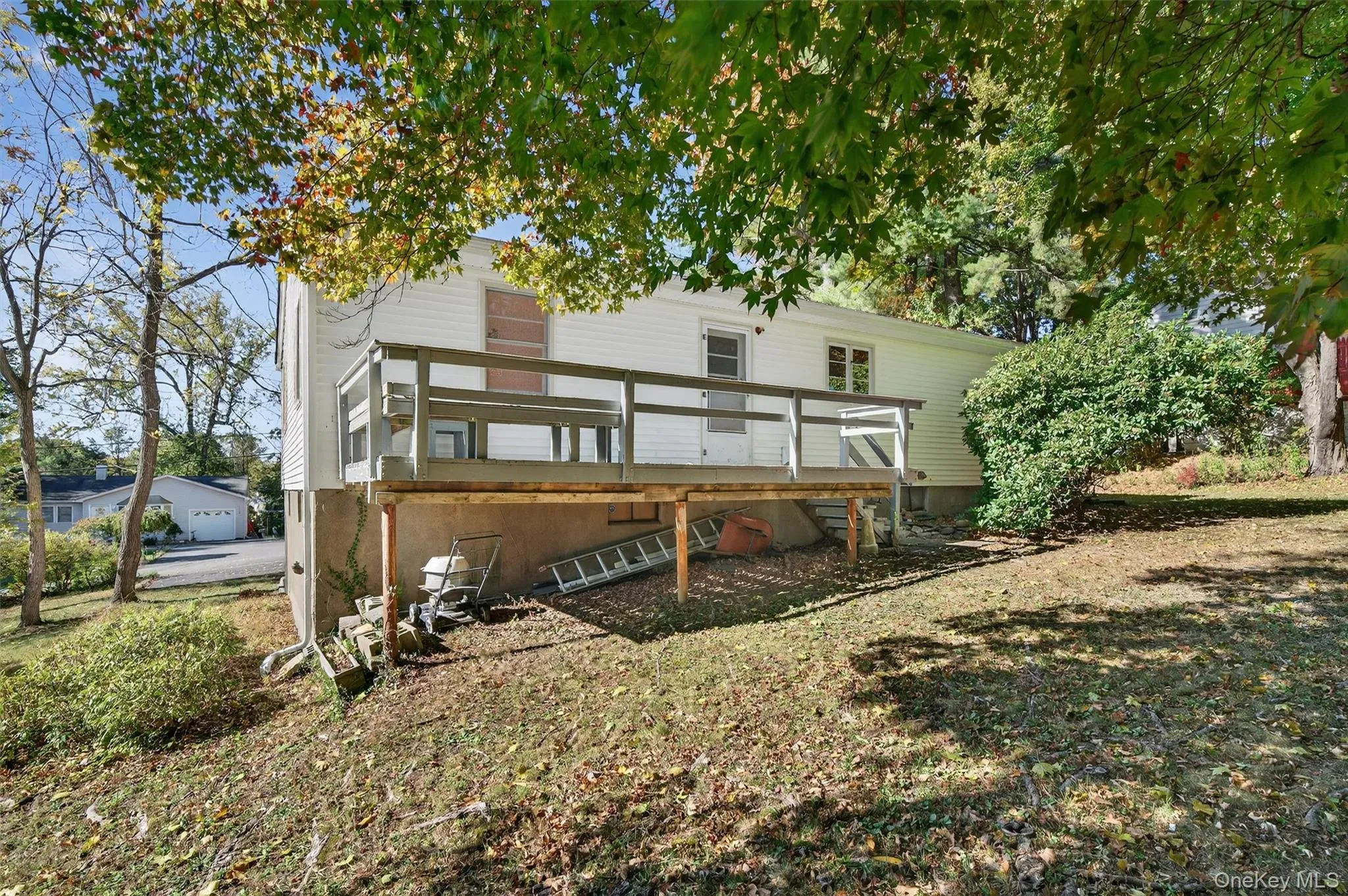 Rear view of house featuring a deck Rear view of house featuring a deck