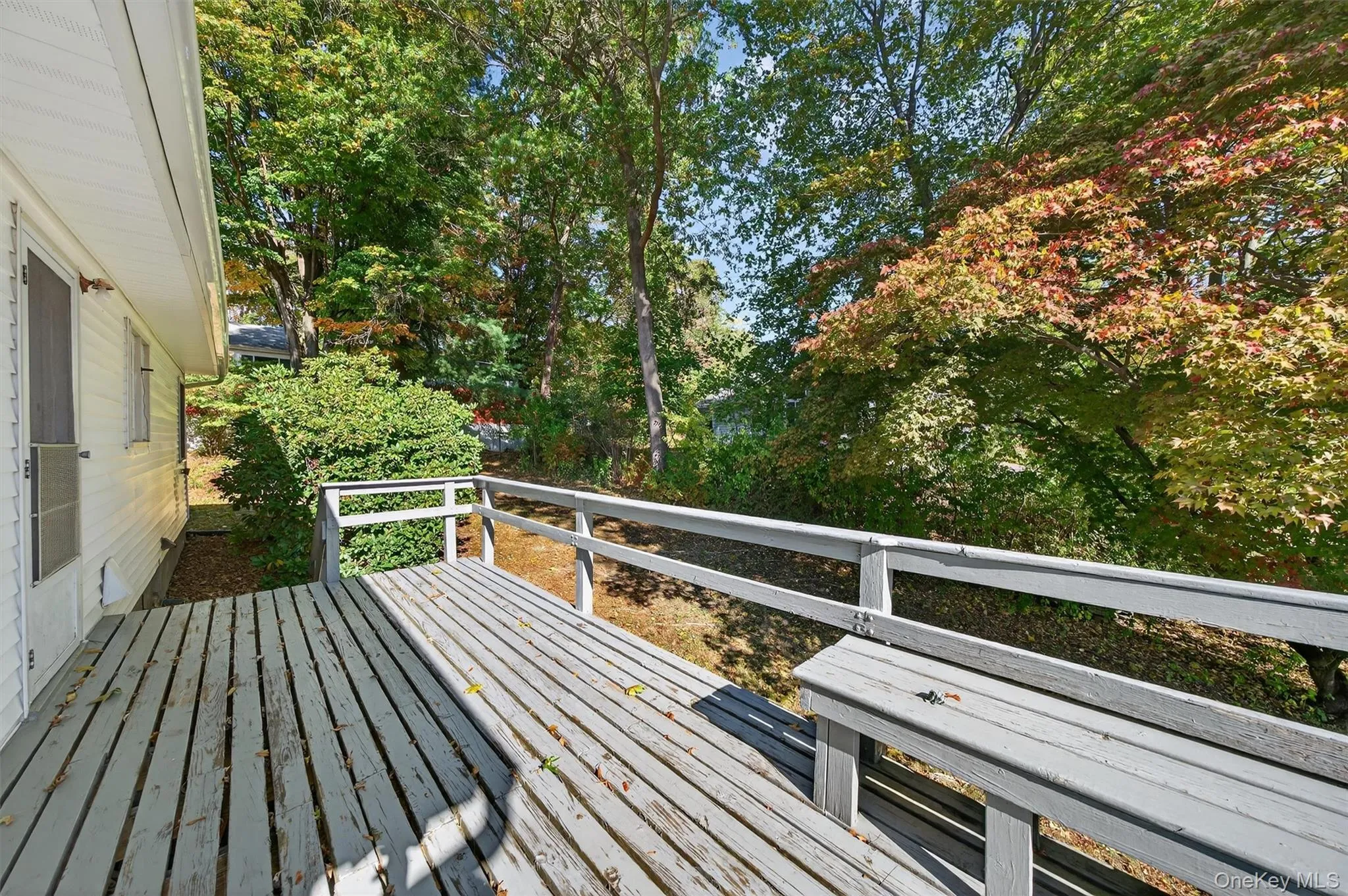 Deck with view of wooded area Deck with view of wooded area