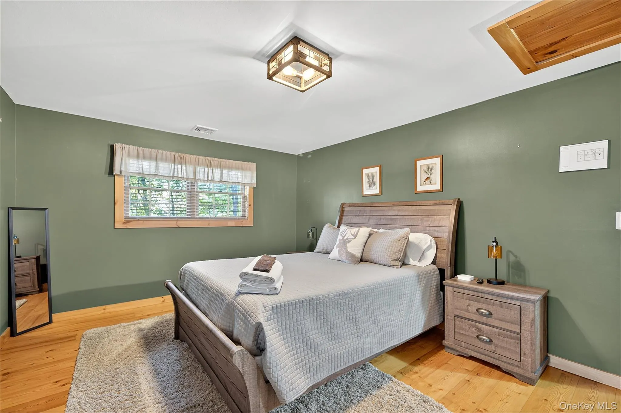 Bedroom featuring light wood-type flooring Bedroom featuring light wood-type flooring