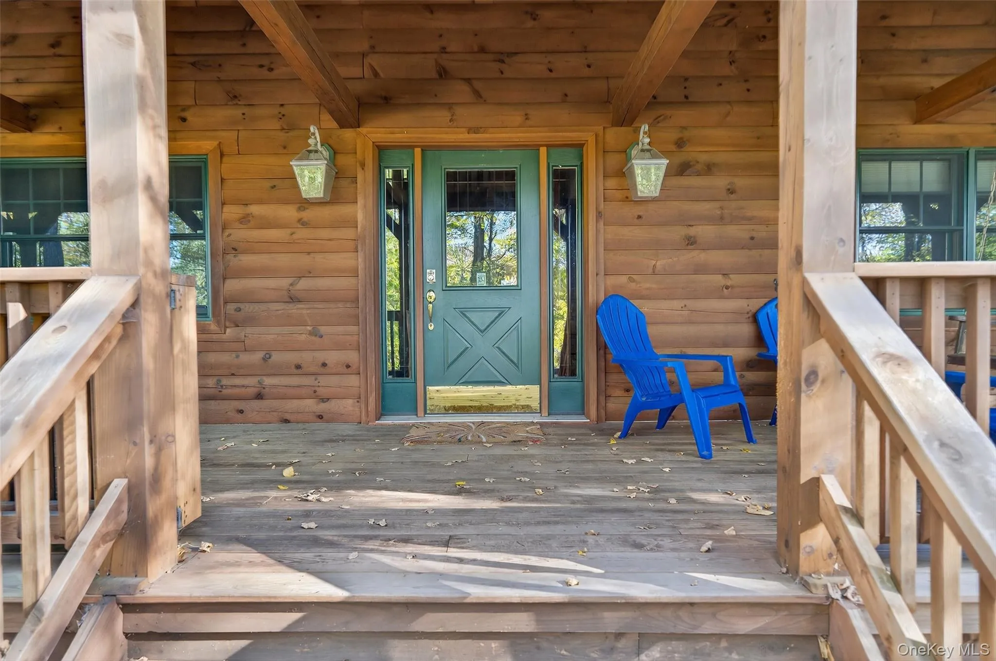 View of exterior entry featuring a wooden deck View of exterior entry featuring a wooden deck