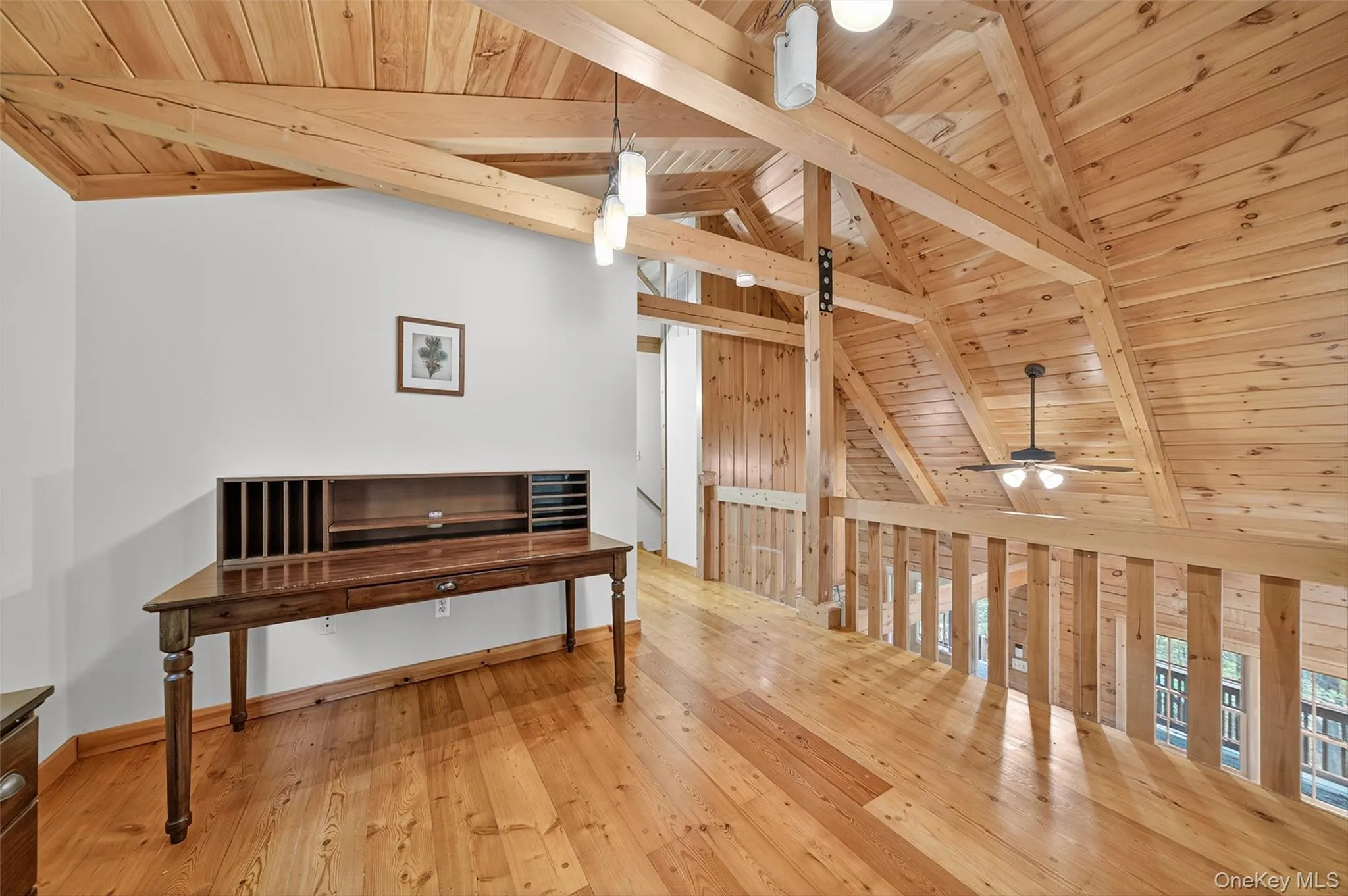 Bonus room with wood ceiling and light wood-style flooring Bonus room with wood ceiling and light wood-style flooring
