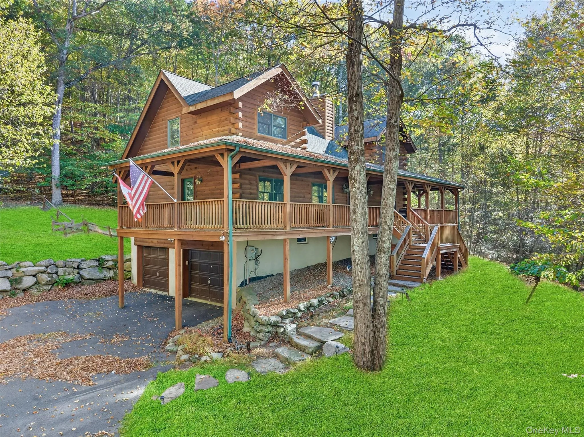 View of front of house featuring a large porch, a front lawn, a chimney, and driveway View of front of house featuring a large porch, a front lawn, a chimney, and driveway