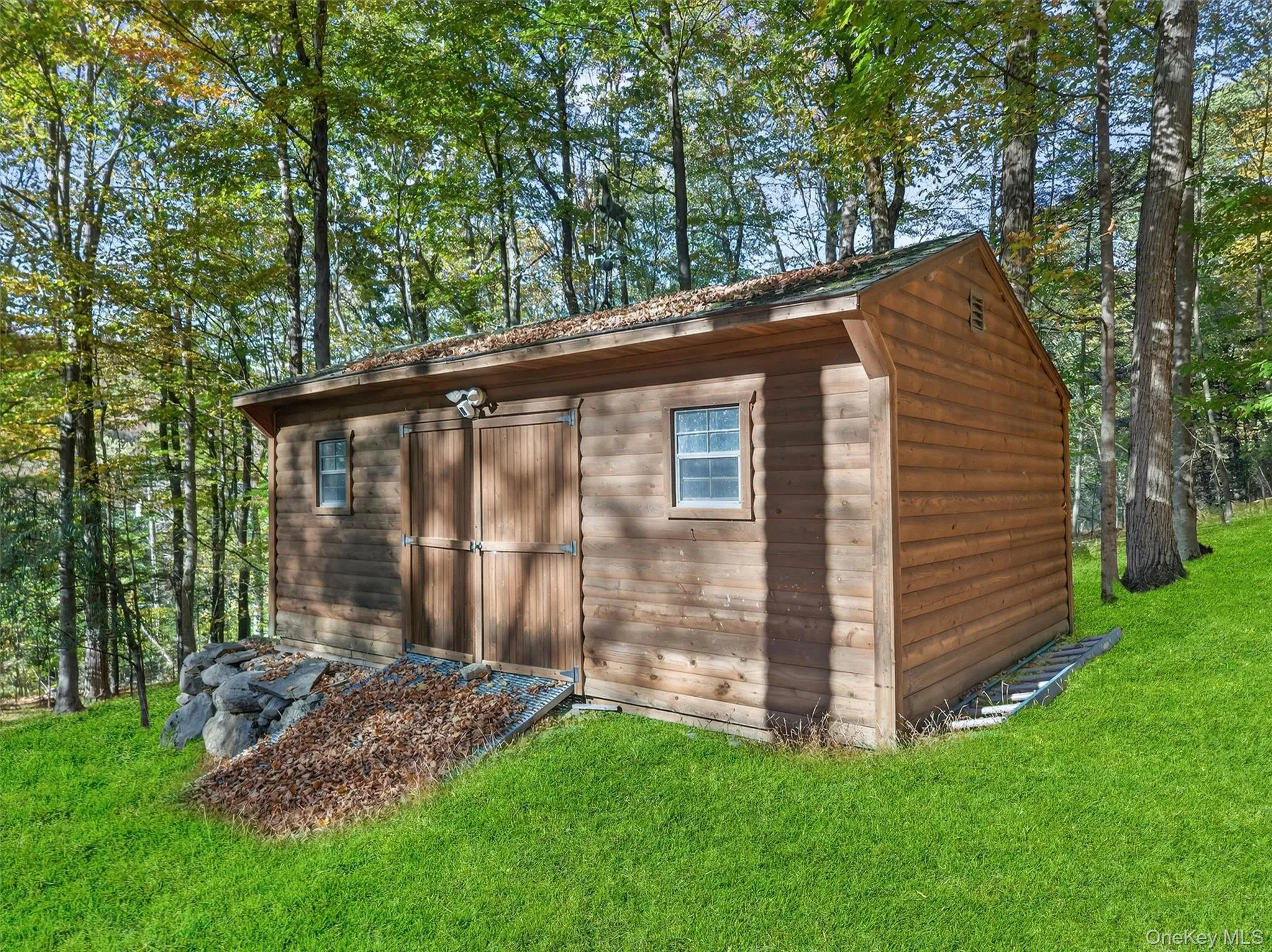 View of shed featuring view of scattered trees View of shed featuring view of scattered trees