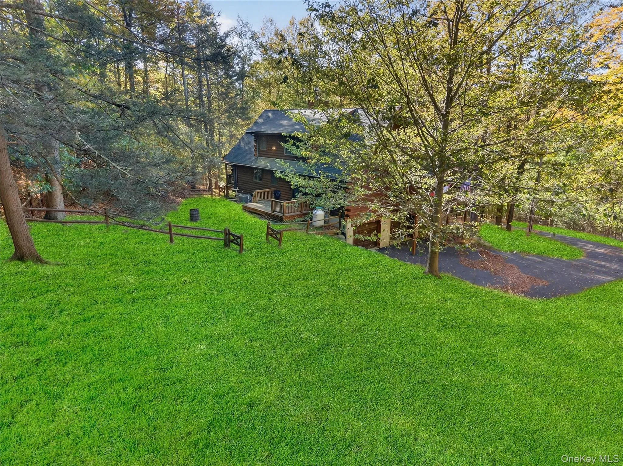 View of yard with a wooden deck View of yard with a wooden deck