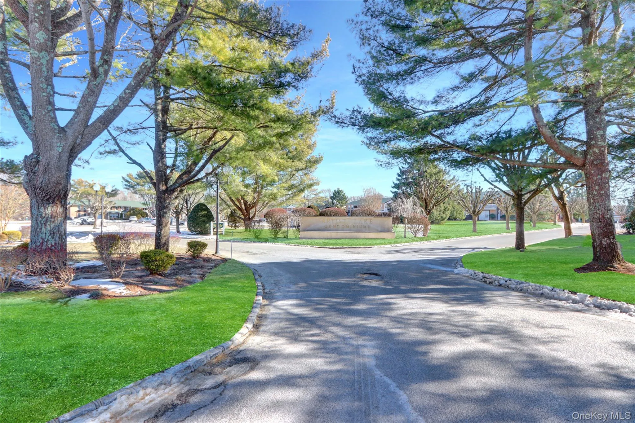 View of asphalt road with curbs View of asphalt road with curbs