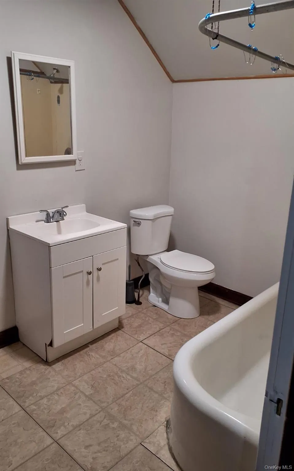 Full bathroom with vanity, a tub, and ornamental molding Full bathroom with vanity, a tub, and ornamental molding