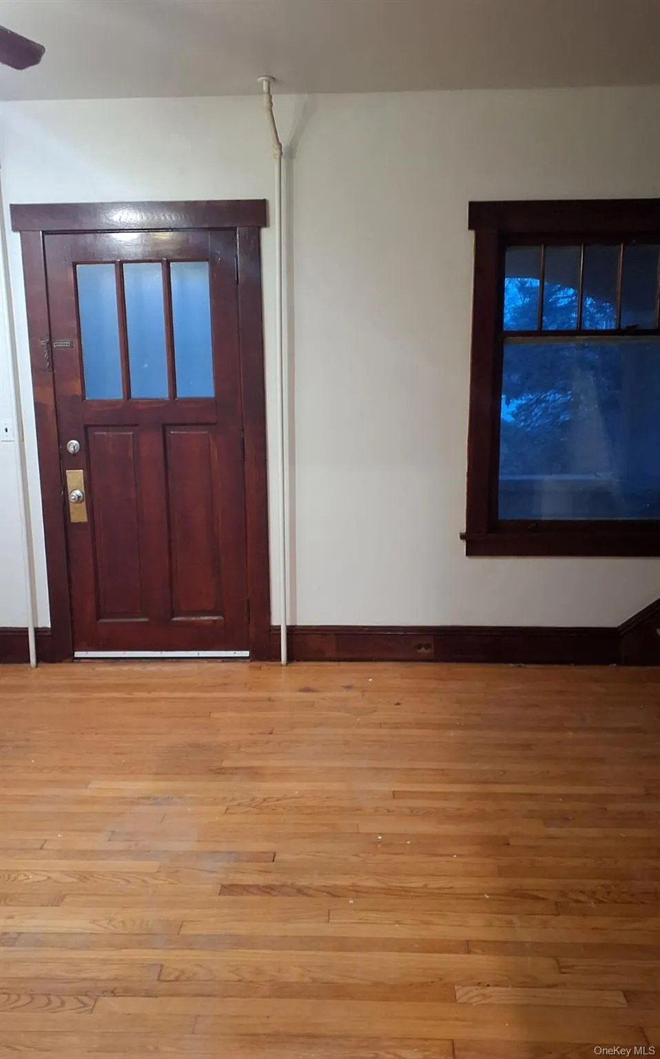 Foyer entrance with hardwood / wood-style floors Foyer entrance with hardwood / wood-style floors