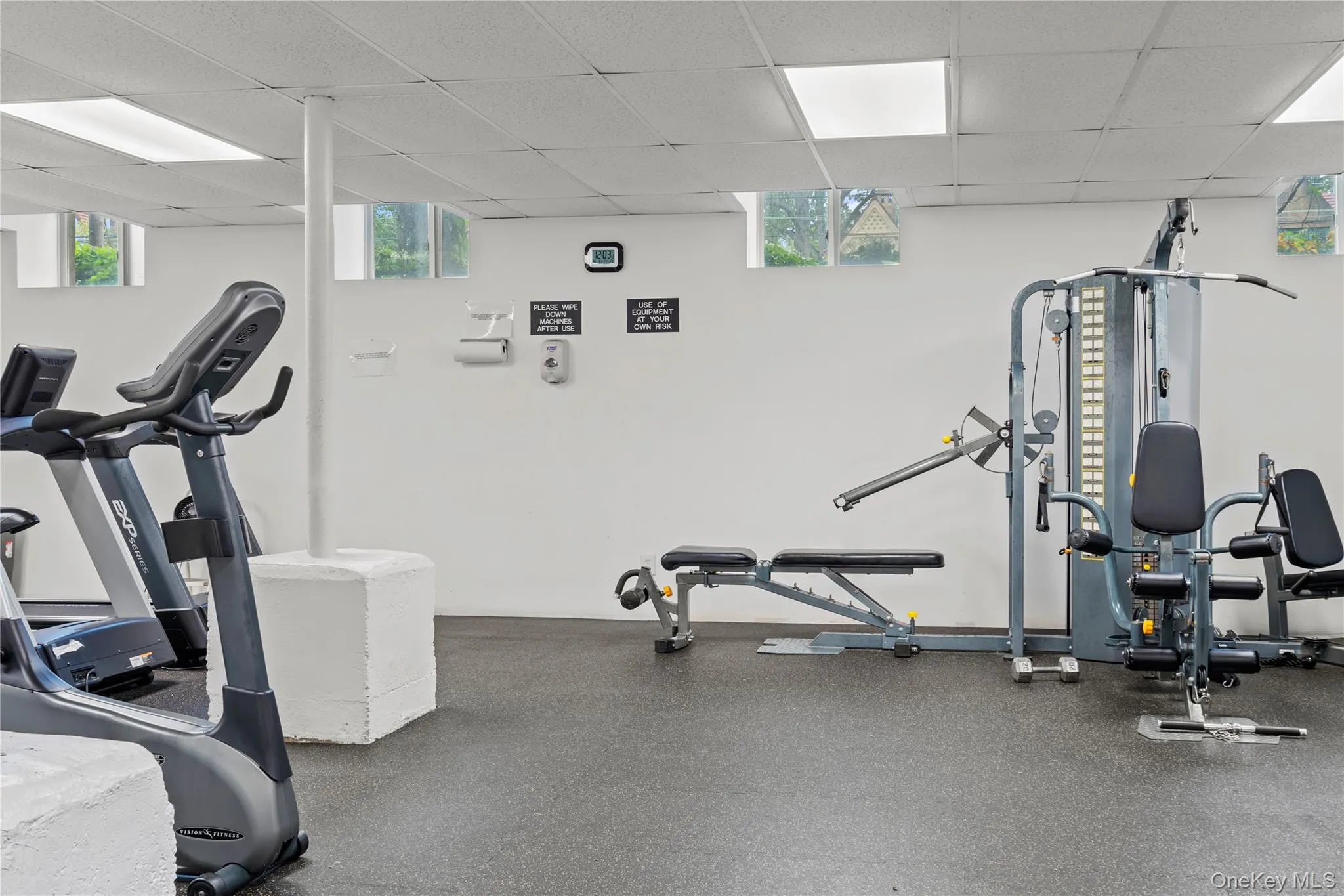 Gym featuring a paneled ceiling Gym featuring a paneled ceiling