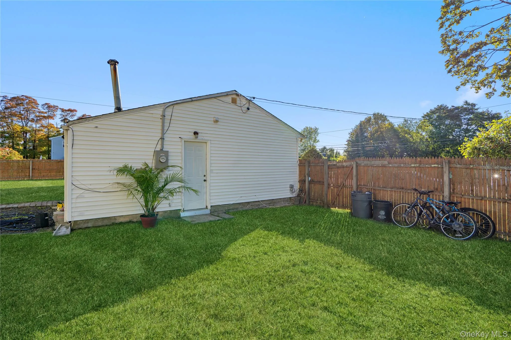 Rear view of house with a fenced backyard Rear view of house with a fenced backyard