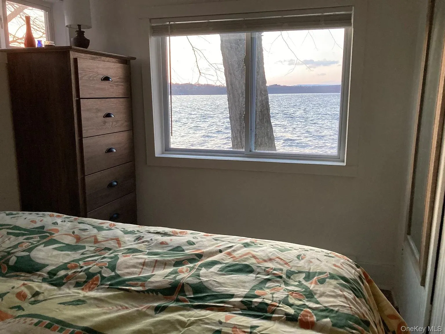 Bedroom with a water view Bedroom with a water view
