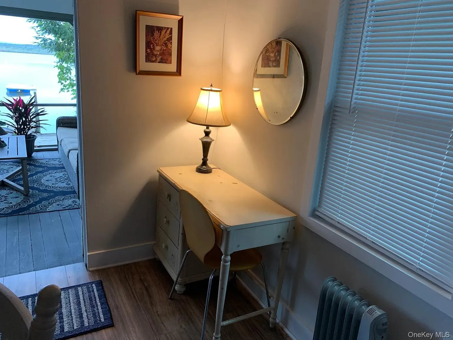 Office space featuring dark wood-style flooring and radiator Office space featuring dark wood-style flooring and radiator