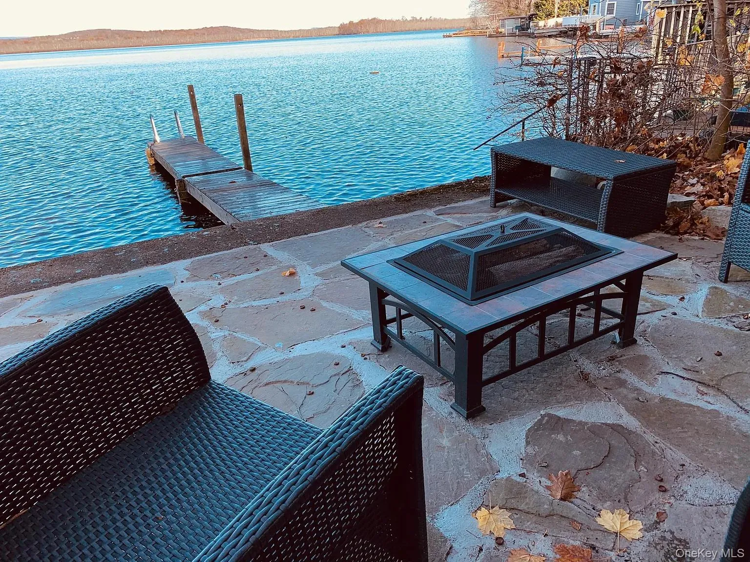 View of swimming pool featuring a water view, a patio, and a floating dock View of swimming pool featuring a water view, a patio, and a floating dock