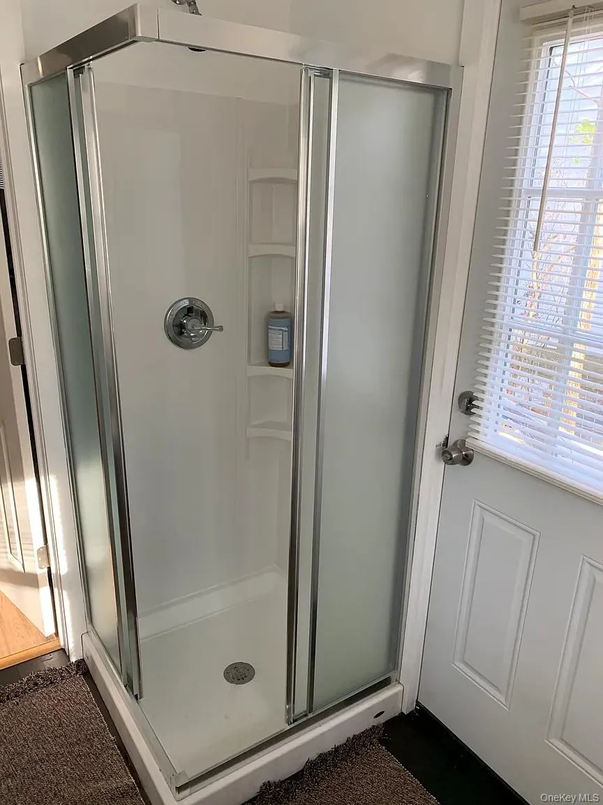Full bathroom with a stall shower Full bathroom with a stall shower
